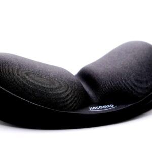 a close up of a black pillow on a white surface